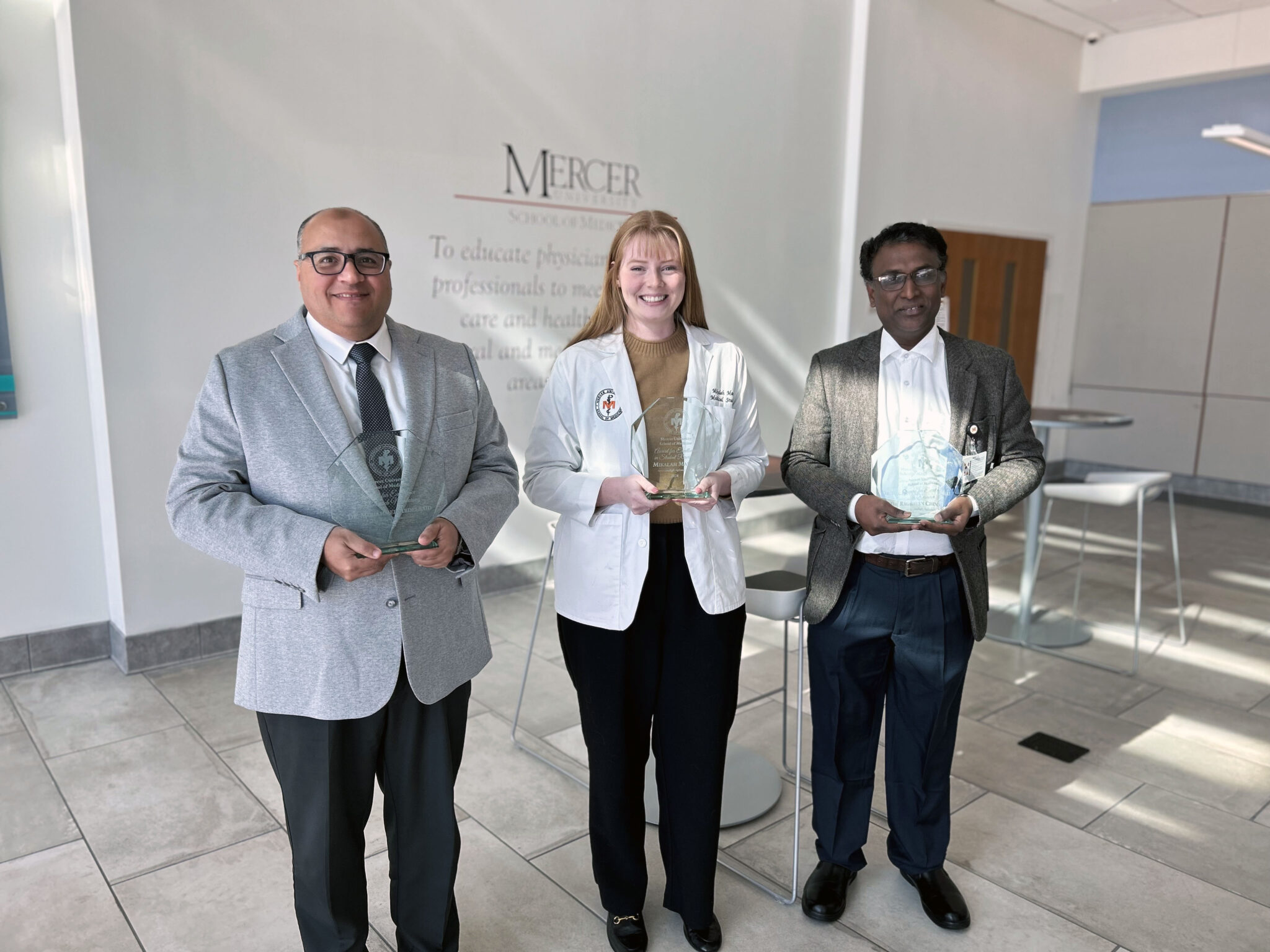 research scientists holding awards