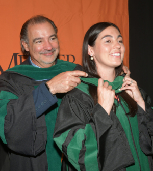 medical student during hooding ceremony