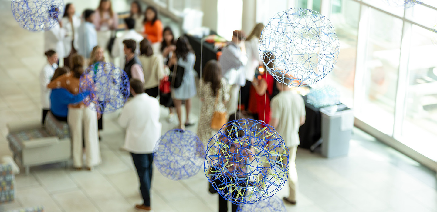 Looking down in the lobby with blue and green spheres