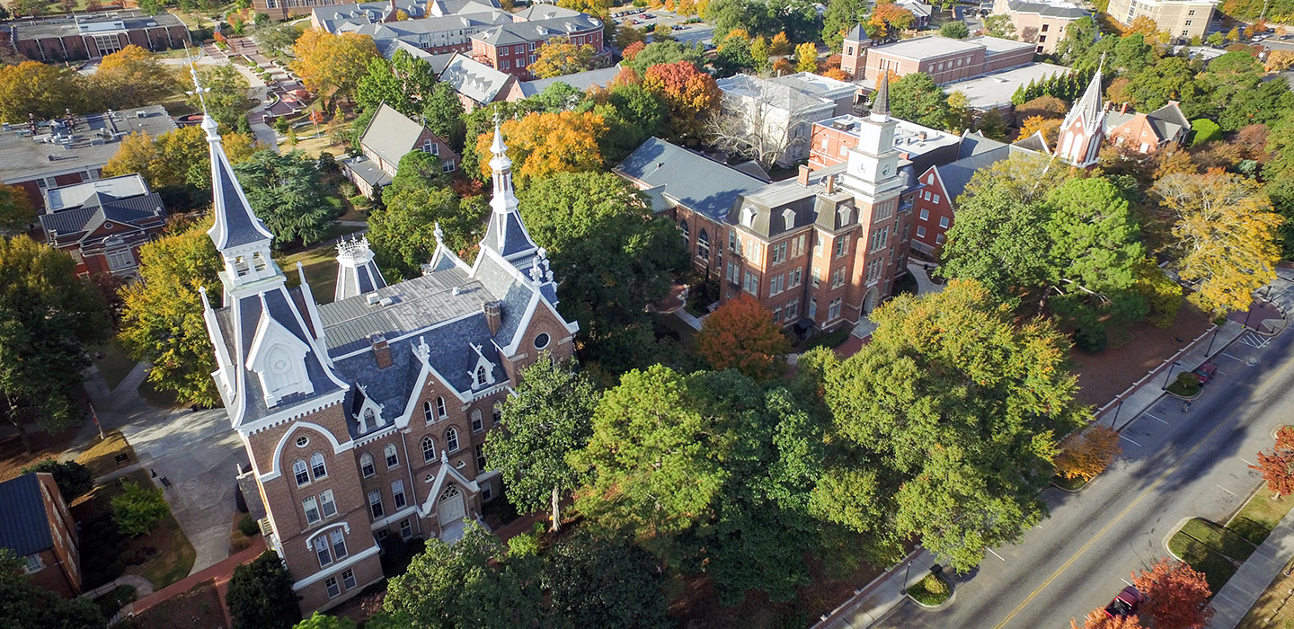 Drone photo of Macon with campus buildings and roof line.