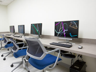 Room with table and computer monitors.