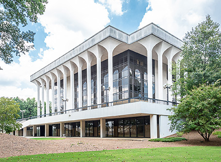 Modern white column building with blue sky