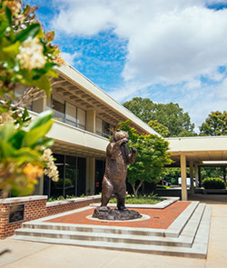 Outside with standing Bear statue