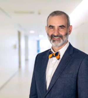 Dr. Matthew Varn wearing a suit with an orange and black bow tie.